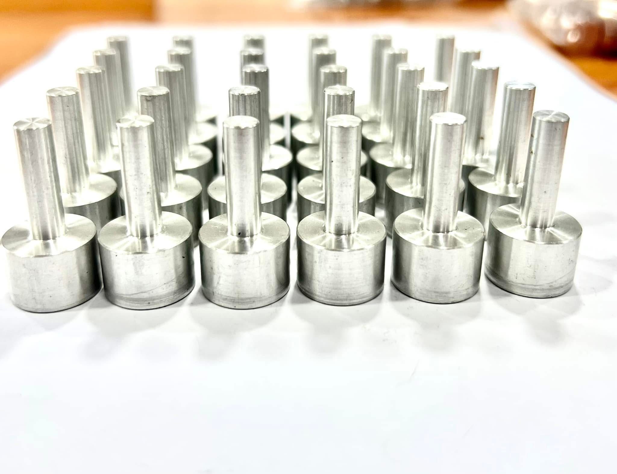 Threaded metal studs in volume
