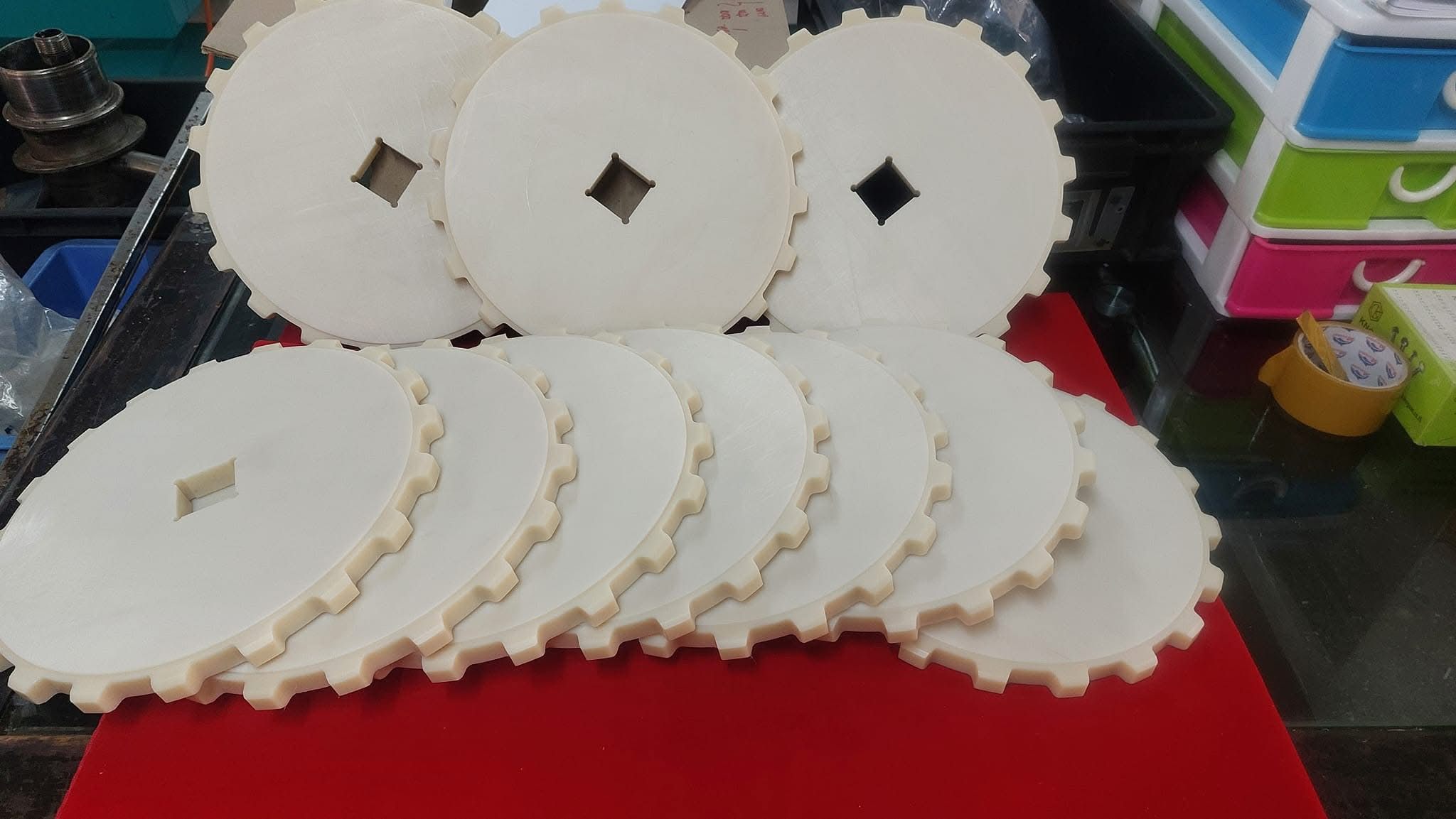 White plastic sprocket discs
