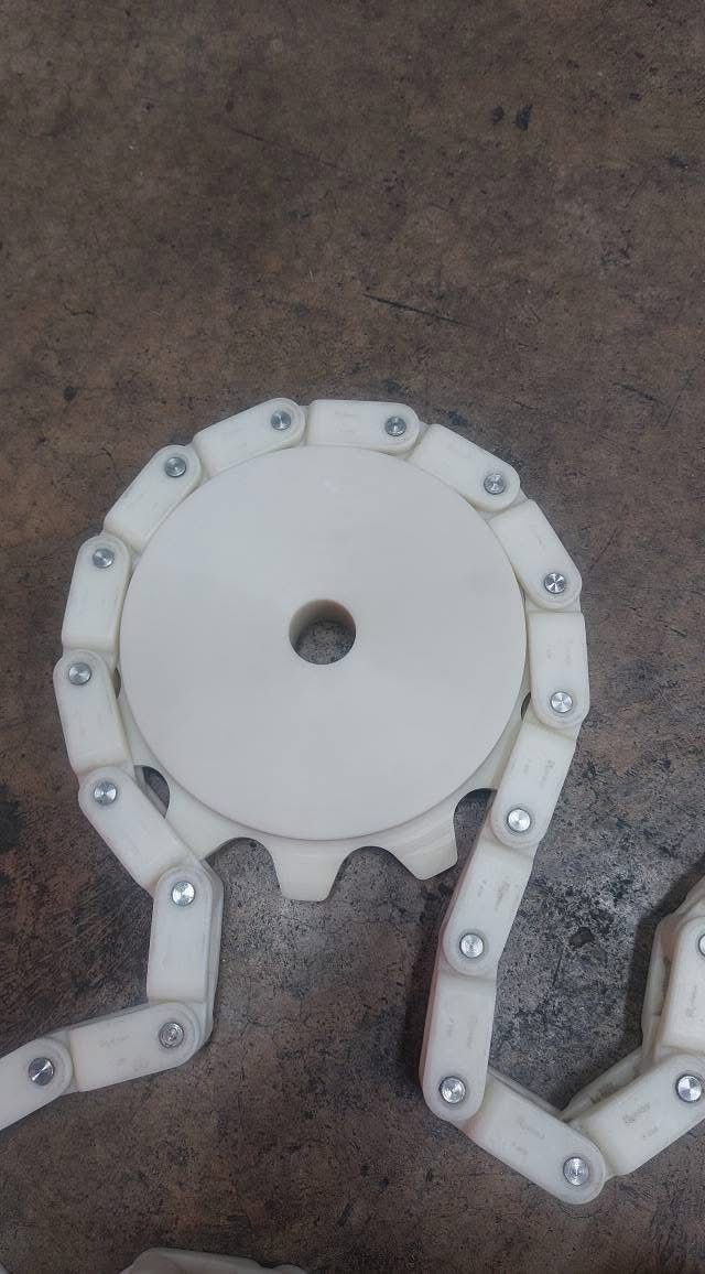 White plastic conveyor chain links