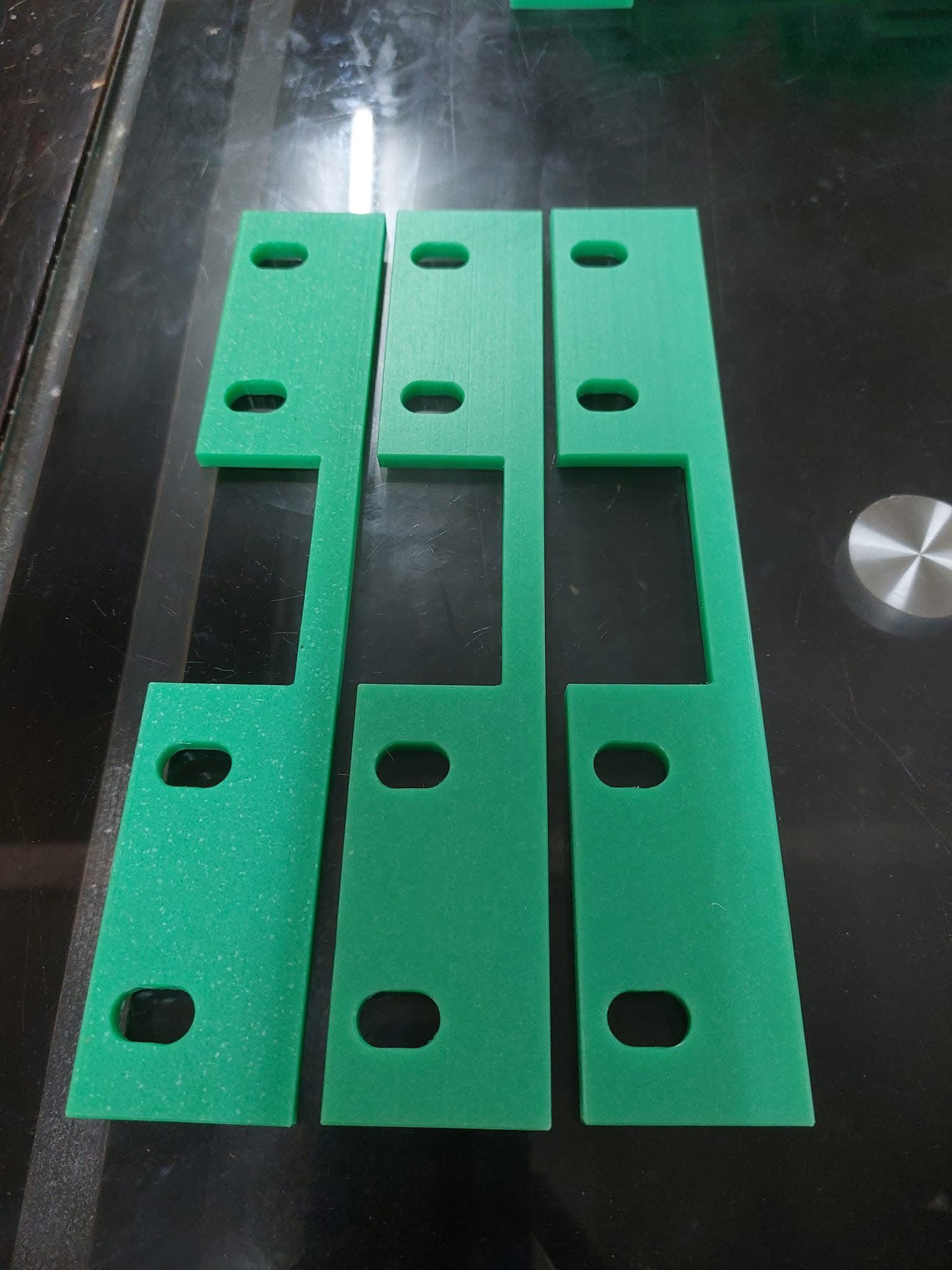 Green PE plates cut and drilled to drawing